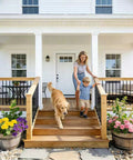 Round Wrought Iron Look Stair Balusters Heavy Duty Interior Exterior Deck Railing Spindles Built Tough For Home Projects 44 Inches Tall in use with family and dog.