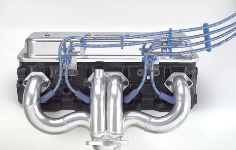 Vehicle Specific Wire Loom Kit With Chrome Engine Brackets shown on engine, highlighting organized wiring and chrome fittings.