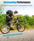 Cyclist using a 24 Inch Electric Bicycle Conversion Kit with 750W Front Wheel, 35Nm Torque, outdoors on a road.