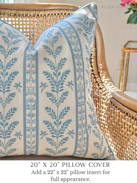 Blue Floral Block Print Pillow Cover With Off White Background, Cozy Throw Pillow Cover For Sofa Or Bed, Grandmillennial Style With Leaf Detail, Subtle Blue Grey Piping, Durable Upholstery Fabric, 20x20 pillow cover on wicker chair