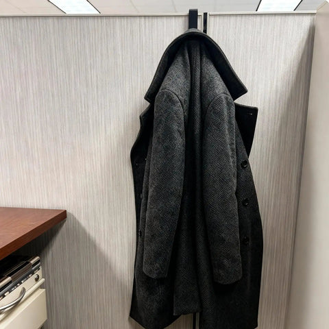 4 Pack Adjustable Cubicle Hooks For 1.8 To 3.5 Inch Panels And Walls, Plastic Coat Hooks For Laptops, Bags, Cases, And Coats, Sturdy Hangers With Easy Install, Style 1 Black holding a gray coat on office partition.