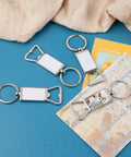 10 Pack Sublimation Blanks Keychains Aluminum Bottle Opener Transfer Key Rings For Custom DIY Gifts And Dope Crafts on table