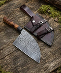 Damascus Steel Chef Knife With 7 Inch Blade And Full Tang A Beast Of A Meat Cutting Knife for BBQ with leather sheath on wood