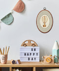 Vintage Cute Golden Retriever Nursery Oval Wall Art With Gray Striped Hot Air Balloon Framed Canvas Prints in playroom