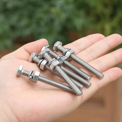 Nuts And Bolts Set 1/4-20 By 2-1/2 Inch Stainless Steel With Hex Nuts And Flat And Lock Washers held in hand