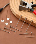 Top Shelf Long Thumb Tacks And Heavy Duty Push Pins, Flat Head Furniture Tacks For Sofa And Headboard Decor, Silver Finished Upholstery Nails Straight Up Diy Essential With Knockout Hold And Quick Install with tools on wood and leather surface.