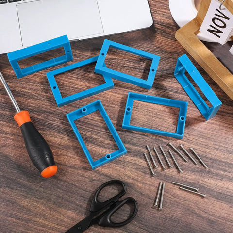 Six Pack Half Inch Single Gang Receptacle Box Extenders With Twelve Screws For Electric Boxes And Outlets That Stop Dents And Blend Into Any Wall Blue on table with tools