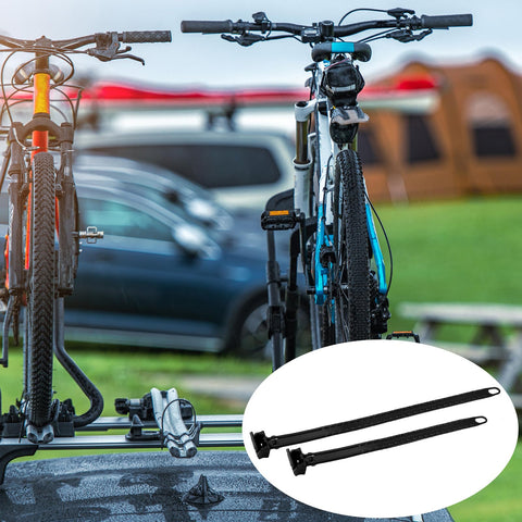 8 Piece Cradle Ratchet Strap Kit For Bike Racks And Roof Carriers, securing bikes on a car roof in a campsite setting.