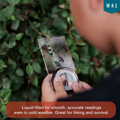 Child holding Liquid Filled Compass Kit For Hiking With Trail Ready Rotating Bezel, Quick Tip Guide, And Carabiner outdoors