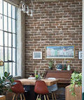 Brown Brick Peel And Stick Wallpaper Roll 17.7 Inches By 393.7 Inches No Glue Needed Easy Peel And Stick Self Adhesive Vinyl Faux 3D Textured Brick Look Waterproof Durable PVC Perfect For Quick Home Makeovers covering wall in dining area with table and chairs.