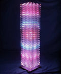 DIY LED Cube Kit For Soldering Projects With 8x8x32 RGB LEDs, Pre Soldered Mainboard And Pre Programmed Controller, Perfect For Electronics Courses And Hobbyists, Dynamic Lighting Effects And Easy Assembly. 8x8x32 RGB LED cube lit on a black base.