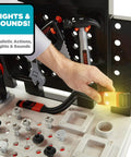 Close-up of Kids Power Tools Workshop Bench With 75 Realistic Tools, Lights And Sounds, showing a hand using a light-up drill tool.