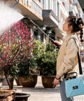 Person using 5L Powerful Electric Garden Sprayer With Adjustable Nozzle For Farm And Home Use Beast Mode Ready