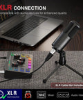 XLR Dynamic Microphone With Cardioid Pattern For Studio Audio on tripod stand next to mixer and laptop, black sturdy metal body