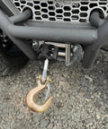 Bfxm Rubber Winch Cable Stopper With Allen Wrench For Cable Protection Reduce Damage To Bumper During Winch Operations High Quality Safety Gear Accessory attached to a winch with a steel hook.