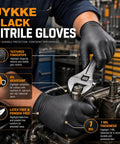 Heavy Duty 7 Mil Black Nitrile Disposable Gloves For Mechanics Built Different Rock Solid Puncture Resistance And Dang Good Grip Packaged In A Slick Dispenser Box worn while using a wrench in a mechanical workshop.