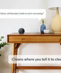 Roomba Combo I5 Plus Self Emptying Robot Vacuum And Mop With Clean By Room With Smart Mapping works with Alexa on a wood table