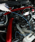 VASTOOLS blue 28in thin flexible magnetic pickup tool, side view in a car engine bay.