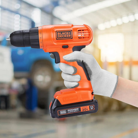 Gloved hand holding 20V Max Cordless Drill demonstrating compact size and lightweight design for DIY projects in workshop