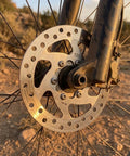 120mm 6-Bolt Stainless Steel Brake Rotor for Electric Scooters and Mountain Bikes, Hollow Design, Installed on Bike Wheel
