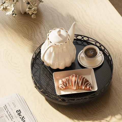 Smooth Spinning Nine Inch Solid Wood Lazy Susan Turntable With Wide Slip Resistant Base And Heavy Duty Spin Mechanism For Kitchen Cabinet Table Top Organization Total Game Changer with teapot, coffee, and croissant.