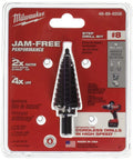 Packaging of a step drill bit with text highlighting jam-free performance, made in USA for Cordless Hammer Drill Driver Kit 18V M18 Red Lithium Half Inch Keyless Chuck Dual Mode High Speed Up To 50 Percent More Holes Per Charge Jam Free Step Bit Included USA Made For Pros And Weekend Warriors.