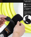 Hands securing a yellow cable with 17 inch hook and loop fasteners. E Track Cord Organizer Straps 4 Pack Heavy Duty Storage.