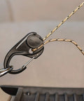 CamJam Rope Tie Down Tightener with carabiner clip securing rope, lightweight cord tightener for light loads on trucks and trailers