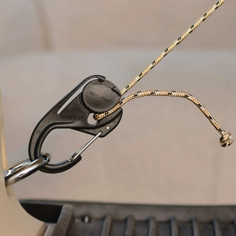 CamJam Rope Tie Down Tightener with carabiner clip securing rope, lightweight cord tightener for light loads on trucks and trailers