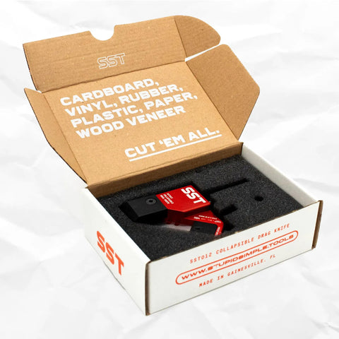 Beefy Drag Knife With 3 By 8 Inch Hardened Steel Shaft in packaging for cutting cardboard, vinyl, rubber, plastic, and wood veneer.