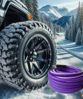 Top Shelf 3/8 X 50 Ft Air Hose Kink Resistant Hybrid Rubber Compressor Line Lightweight Pneumatic Tube next to a rugged tire in snow.