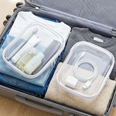 Hella Durable Clear Hard Shell Zipper Cases 6 Pack Water Resistant Storage Pouches For Travel with toiletries and charger in suitcase.