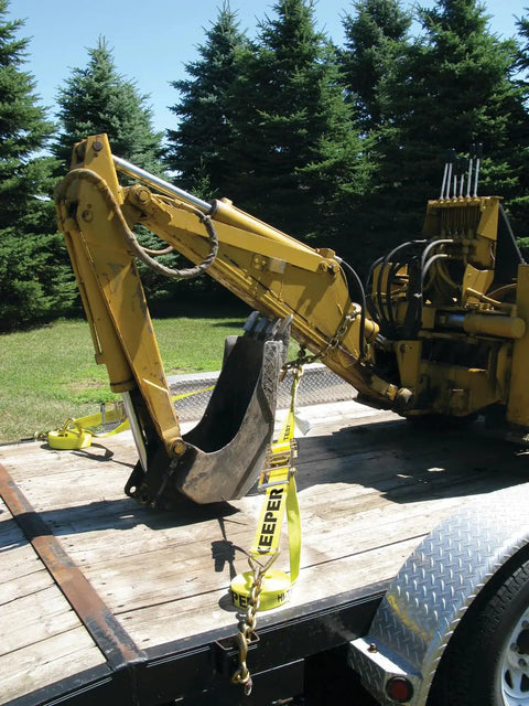 Beefy Heavy Duty 3 Inch By 30 Foot Ratchet Tie Down With Chain End And Grab Hook securing construction equipment on trailer