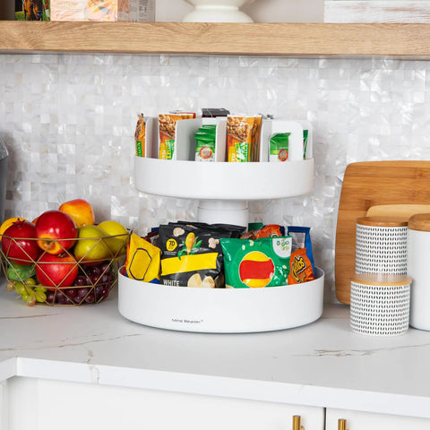 Smooth Rotating Two Tier Snack Carousel Countertop Organizer in white, featuring snacks and fruits displayed elegantly.
