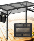 Aluminum Folding Camping Table with 3 adjustable heights up to 27.5 inches, portable for outdoors, shown on a deck with a storage pocket