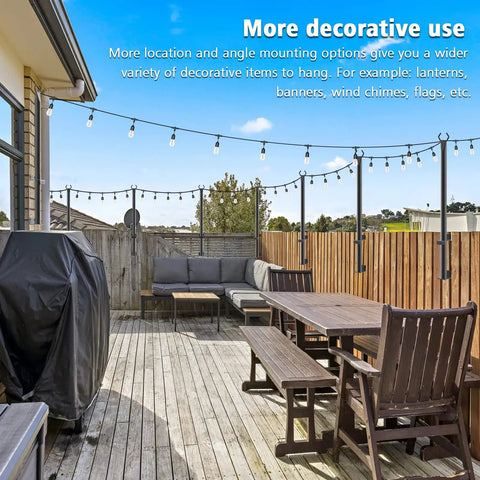 4 Ft Outdoor String Light Poles, 2 Pack, on a freestanding deck with furniture, hanging string lights, wooden fence in background