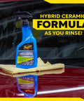 26 oz Easy Spray On Ceramic Wax For Cars With SiO2 Hybrid Barrier Technology on red car hood with towel