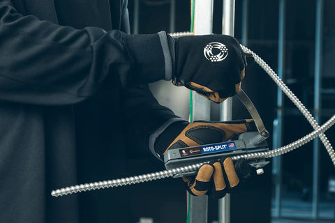 Technician using Roto-Split Wounded Warrior Armored Cable Cutter With Built-In Blade Storage, Heavy-Duty Epoxy-Enamel Body on cable