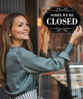 Woman hanging 'Closed' side of Waterproof Double Sided Open Or Closed Sign For Business With Rope Hanging Sign 11.8 By 7.9 Inches