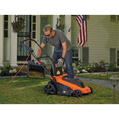 Man using 20 Inch Corded Electric Lawn Mower With 13 Amp Motor Ultra Light No Sweat Push Design 3 In 1 Mowing Versatility