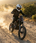 Rider on EM5 Pro 60V Electric Dirt Bike With Light And Display Off Road Motorcycle 5600W Power kicking up dust on trail