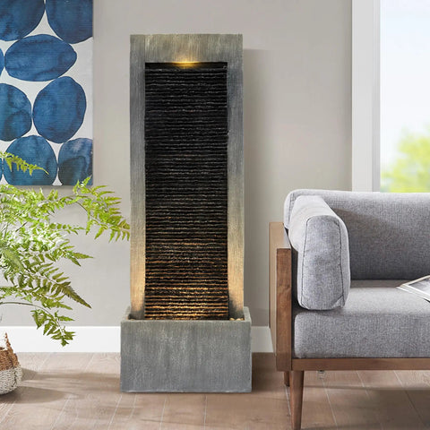 7-Tier Rock Water Fountain With Lights For Outdoor Garden Decor, shown indoors with cascading waterfall and warm LED lights