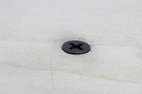 Badass 18-8 Stainless Steel Flat Head Phillips Wood Screws 8 X 3/4 Inch Black Oxide Coated 304 Grade detail on wood surface.