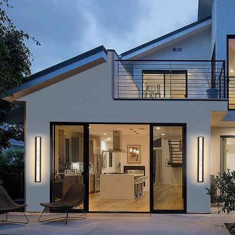 Modern house with Dope Outdoor Wall Light 20W LED Exterior Fixture, 31.5 Inch IP65 Waterproof Sconce illuminating patio doors.