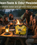 People enjoying a campfire with Two Gallon Collapsible Water Container With Spout For Camping And Outdoors on picnic table.