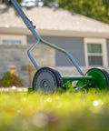 No Sweat 14 Inch 5 Blade Push Reel Lawn Mower with ball bearing reel and cushioned T style handle on grass