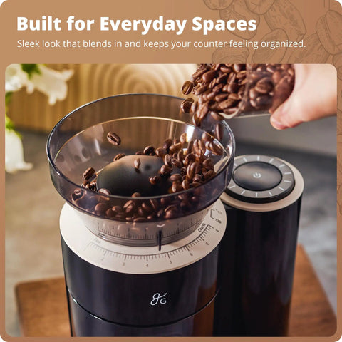 Legit Precision Coffee Grinder with Built in Dosing Scale and Conical Burr System Delivers Straight Up Accurate Results across Eight Grind Steps Perfect for Espresso Pour Over French Press Cold Brew, Matte Black; close-up of coffee beans being poured into the grinder.