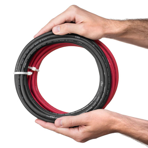 Hands holding Beefy 6 Gauge Premium Extra Flexible Welding Cable 600 Volt Combo Pack, 15 Feet Each Black And Red, Made In USA