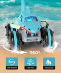 Amphibious RC Shark Car 1:14 Scale navigating sand and water with 360-degree rotation and waterproof features.