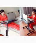 Smooth Operator Height Adjusting Overbed Table Rolling Desktop Stand Up Computer Workstation in use by a person with laptop.
